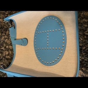 Cute blue and tan crossbody purse.